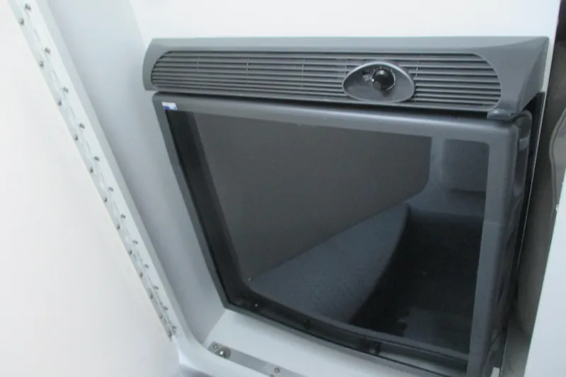 Slide: The Image of 2005 Formula 353 FASTech cabin interior with a compact refrigerator. - 17