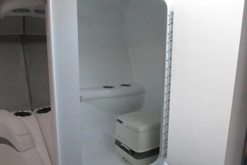 Slide: The Image of 2005 Formula 353 FASTech boat interior with compact bathroom and seating area. - 18