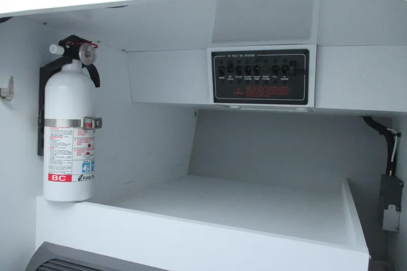 Slide: The Image of 2005 Formula 353 FASTech interior with fire extinguisher and control panel. - 21