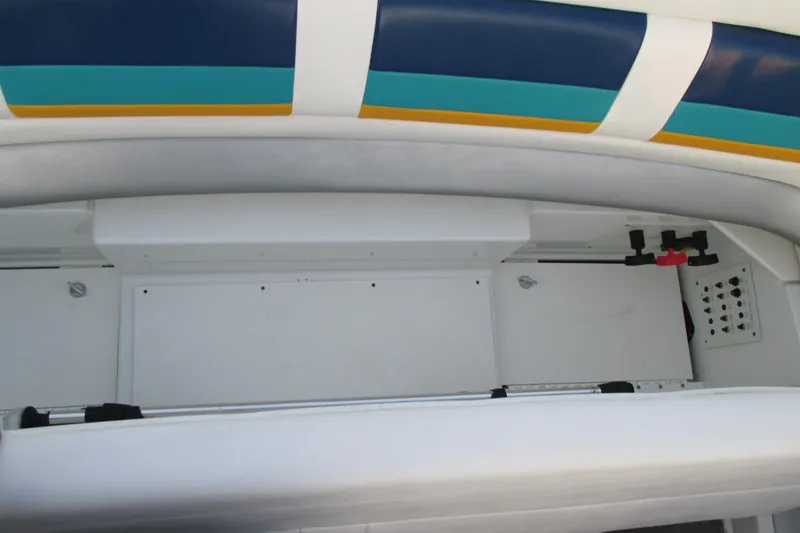 Slide: The Image of 2005 Formula 353 FASTech boat interior storage compartment with colorful upholstery. - 22