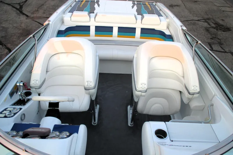 Slide: The Image of 2005 Formula 353 FASTech boat interior with white seating and colorful accents. - 4