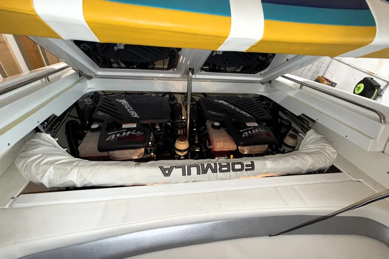 Slide: The Image of 2005 Formula 353 FASTech boat engine compartment with twin Mercury engines. - 5