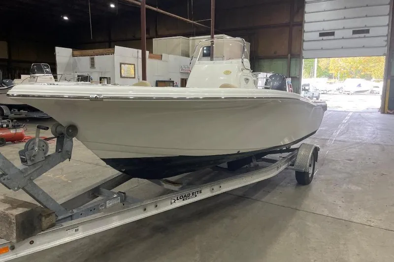 The Image of 2016 Tidewater 198 CC Adventure boat on trailer in warehouse. - 0