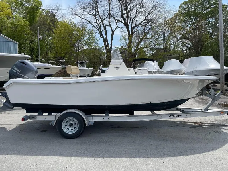 Slide: The Image of 2016 Tidewater 198 Center Console boat on trailer, parked outdoors. - 13