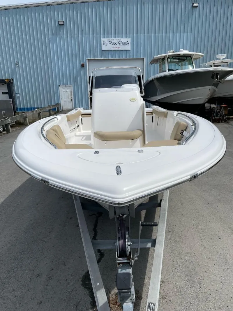 Slide: The Image of 2016 Tidewater 198 Center Console boat on trailer, parked outdoors. - 16