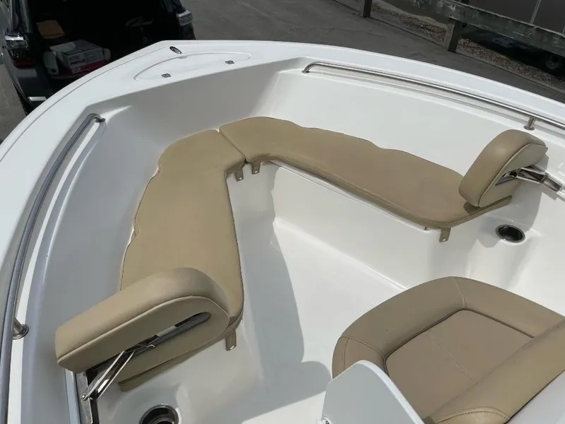 Slide: The Image of 2016 Tidewater 198 Center Console boat with beige seating in bow area. - 19