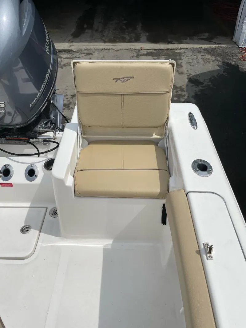 Slide: The Image of 2016 Tidewater 198 Center Console boat seat with beige upholstery. - 23