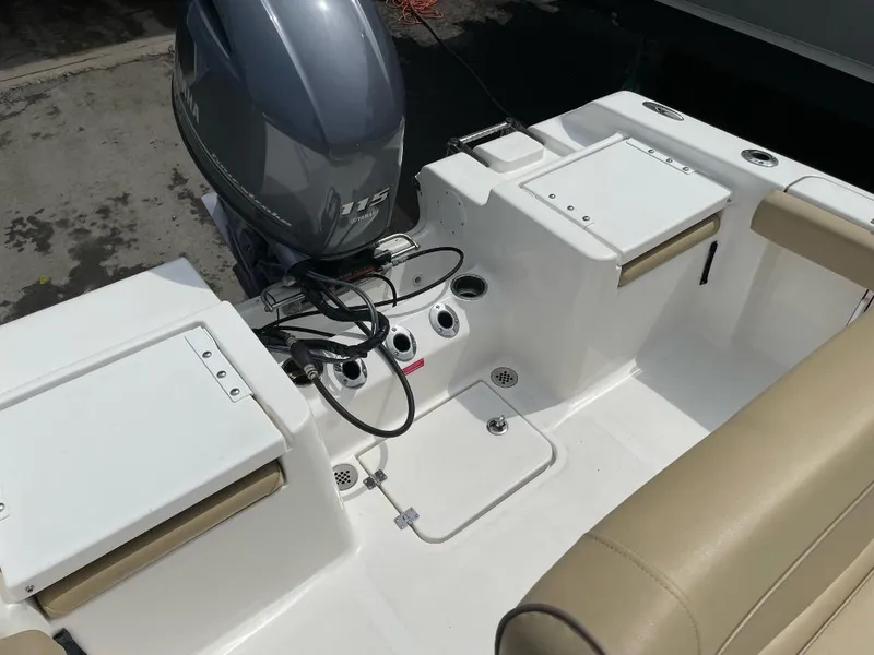 Slide: The Image of 2016 Tidewater 198 Center Console boat interior with motor and seating. - 26