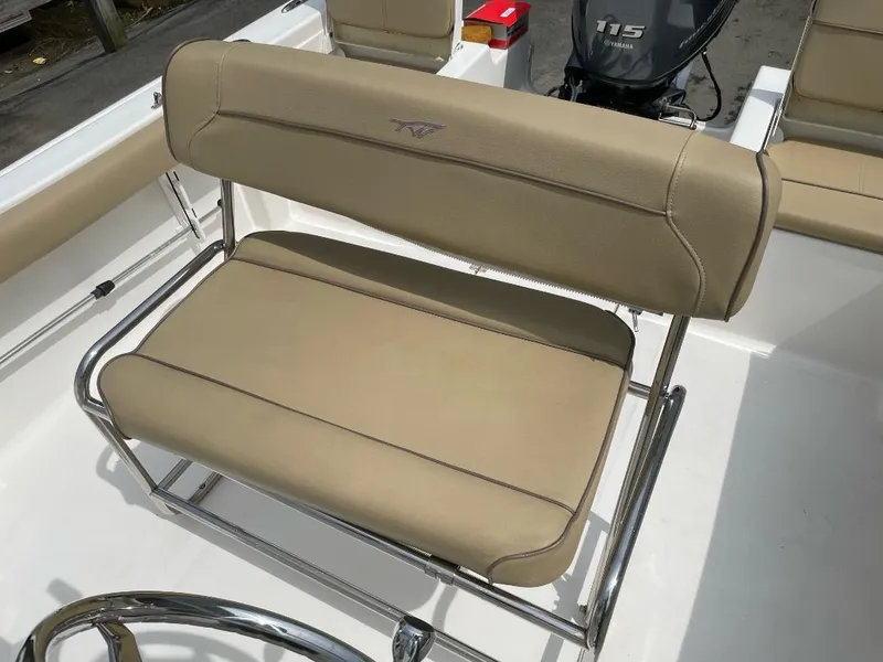 Slide: The Image of 2016 Tidewater 198 Center Console boat with beige seating and stainless steel frame. - 28