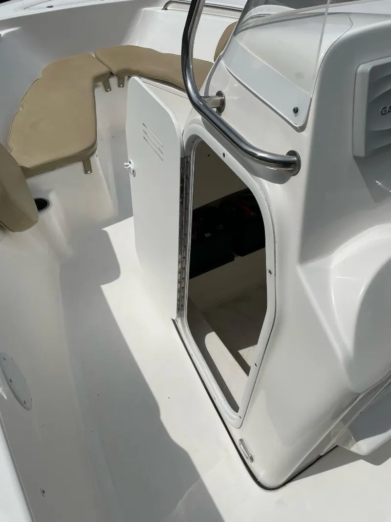 Slide: The Image of 2016 Tidewater 198 Center Console boat interior with open storage compartment. - 31