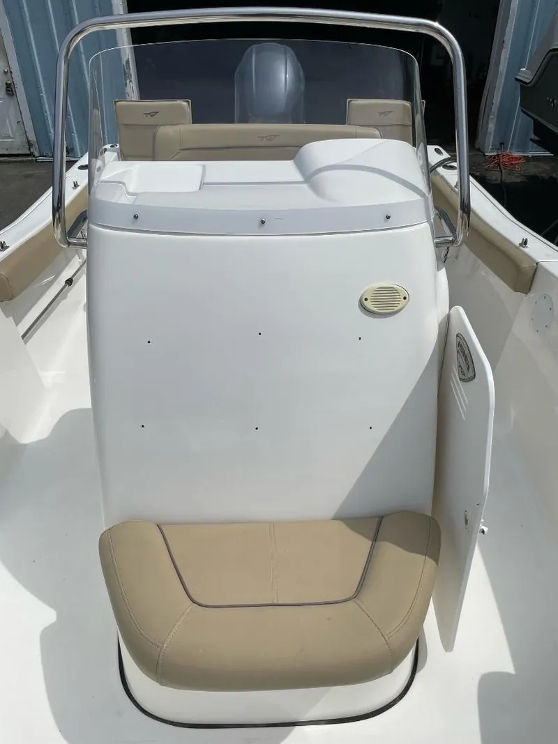 Slide: The Image of 2016 Tidewater 198 Center Console boat with beige seating and white console. - 34
