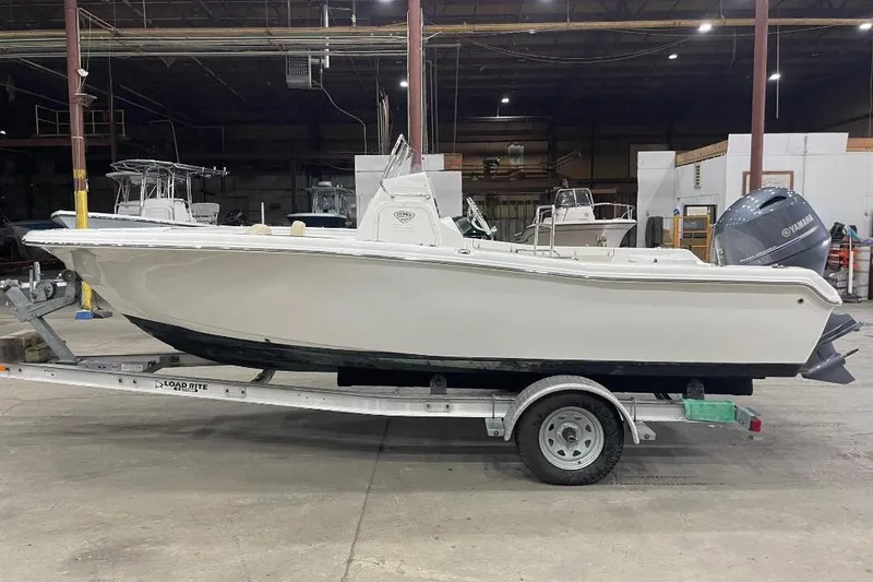 Slide: The Image of 2016 Tidewater 198 CC Adventure boat on trailer in warehouse. - 4