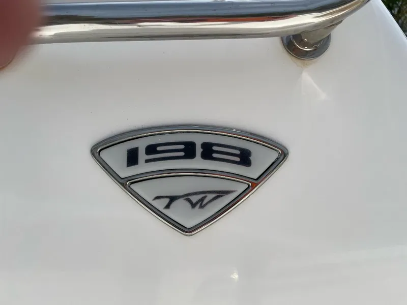 Slide: The Image of 2016 Tidewater 198 Center Console emblem on white surface. - 54
