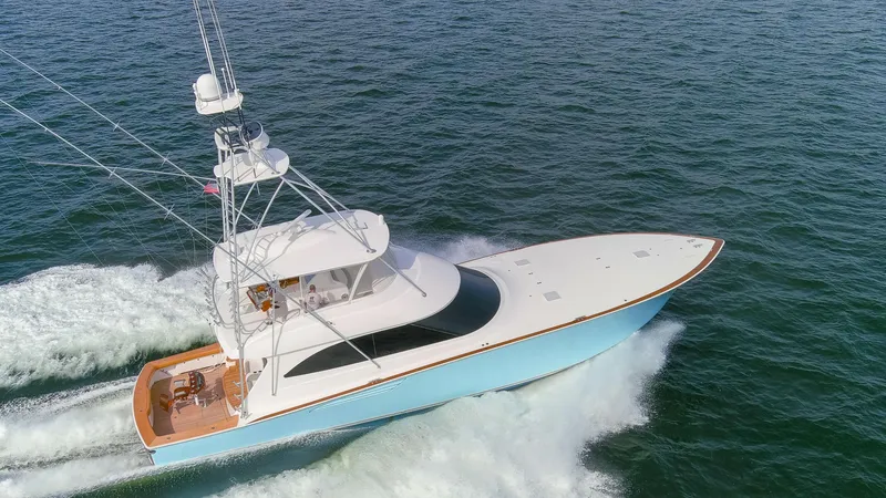 The Image of 2015 Viking 70 Convertible yacht cruising on open water. - 0