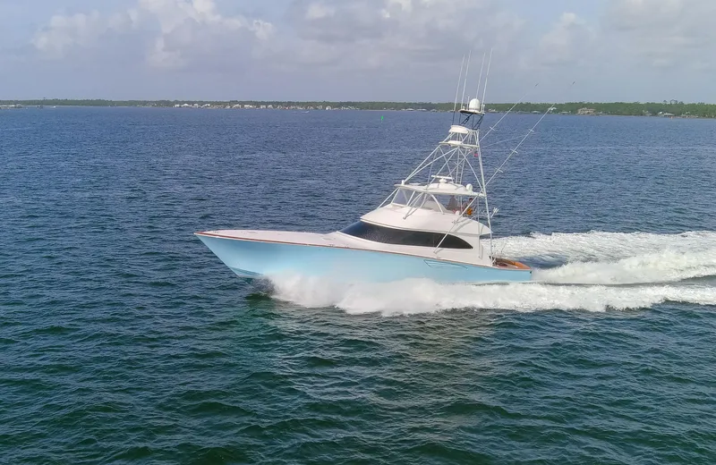 Slide: The Image of 2015 Viking 70 Convertible yacht cruising on open water. - 1