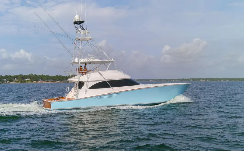 Slide: The Image of 2015 Viking 70 Convertible yacht cruising on open water. - 11