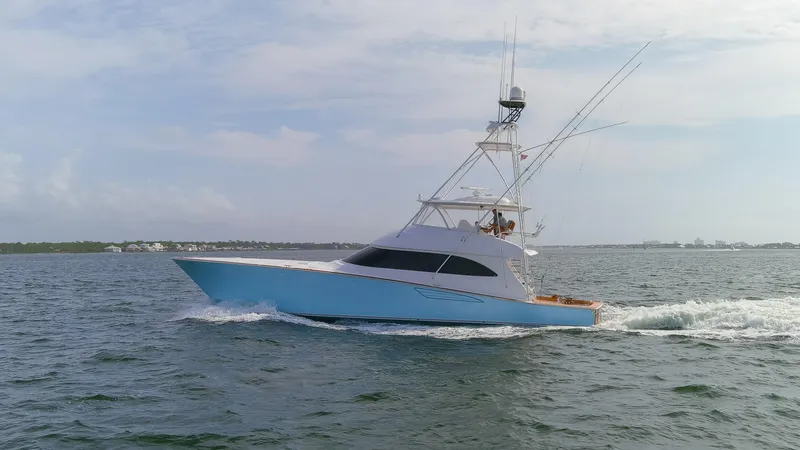 Slide: The Image of 2015 Viking 70 Convertible yacht cruising on open water. - 13