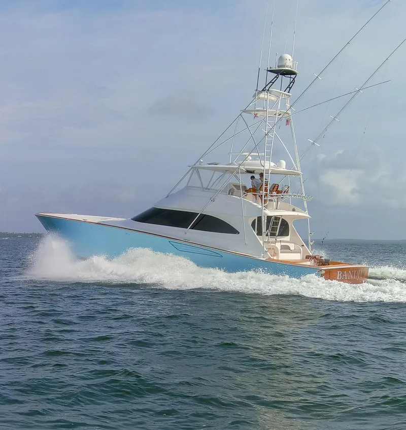Slide: The Image of 2015 Viking 70 Convertible yacht cruising on open water. - 16