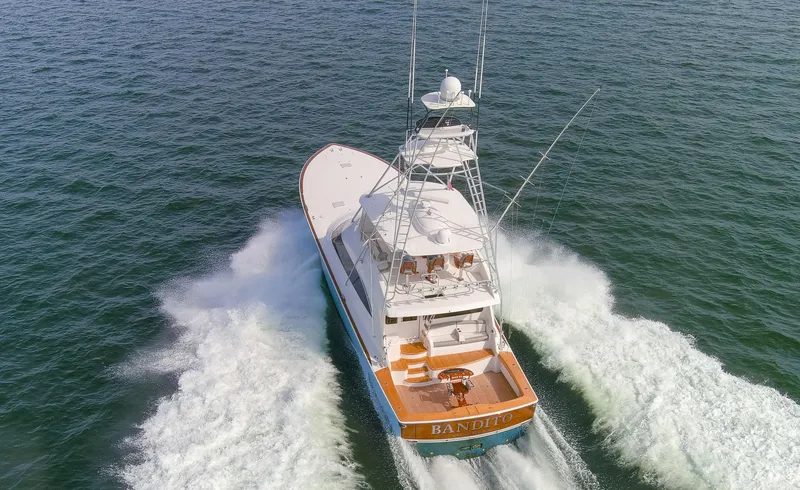 Slide: The Image of 2015 Viking 70 Convertible yacht cruising on open water. - 20
