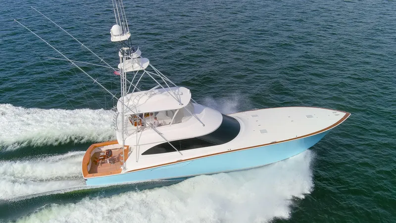Slide: The Image of 2015 Viking 70 Convertible yacht cruising on open water. - 21