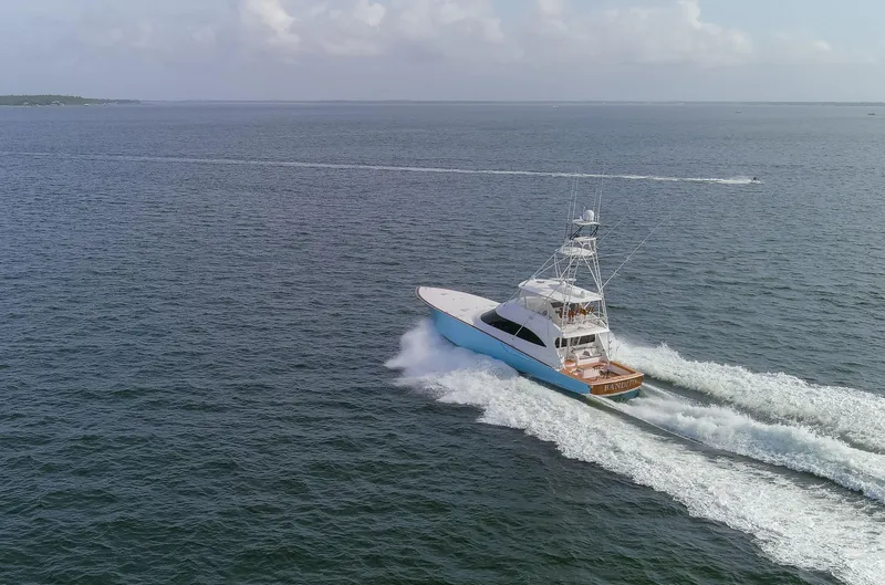 Slide: The Image of 2015 Viking 70 Convertible yacht cruising on open sea. - 22