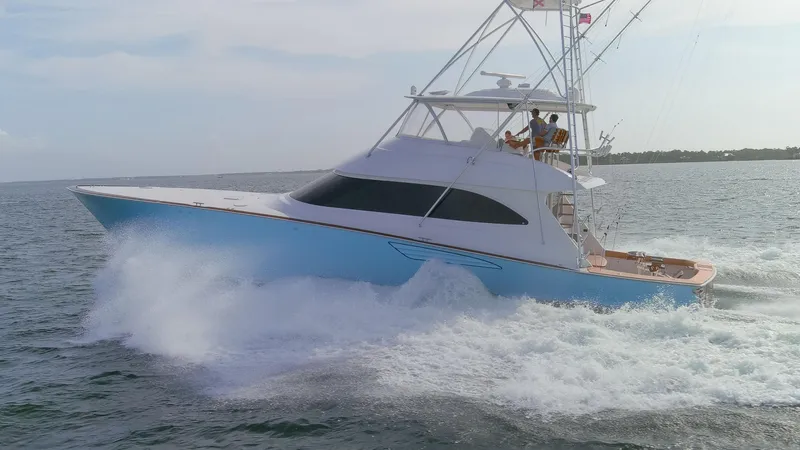 Slide: The Image of 2015 Viking 70 Convertible yacht cruising on open water. - 23