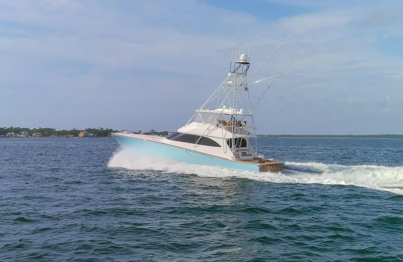 Slide: The Image of 2015 Viking 70 Convertible yacht cruising on open water. - 27