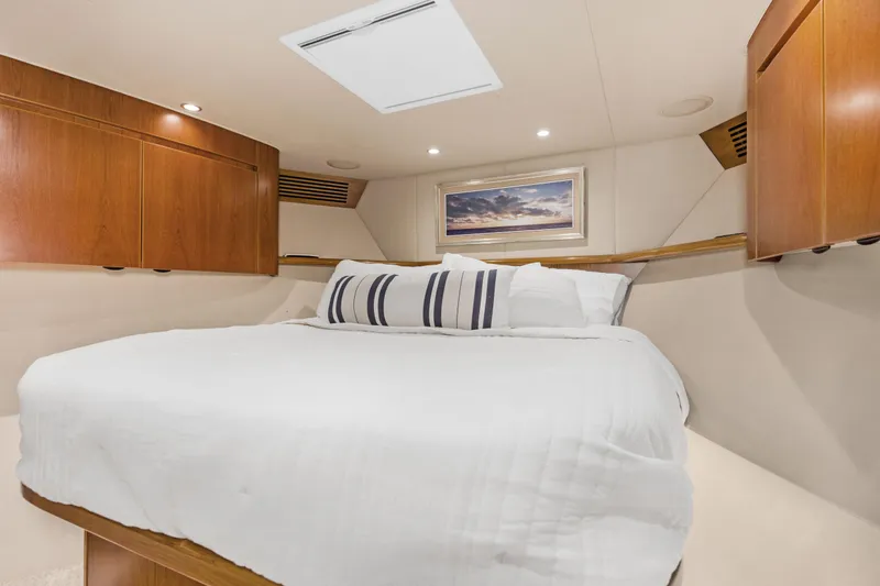 Slide: The Image of Luxurious bedroom interior of 2015 Viking 70 Convertible yacht with elegant wood cabinetry. - 40