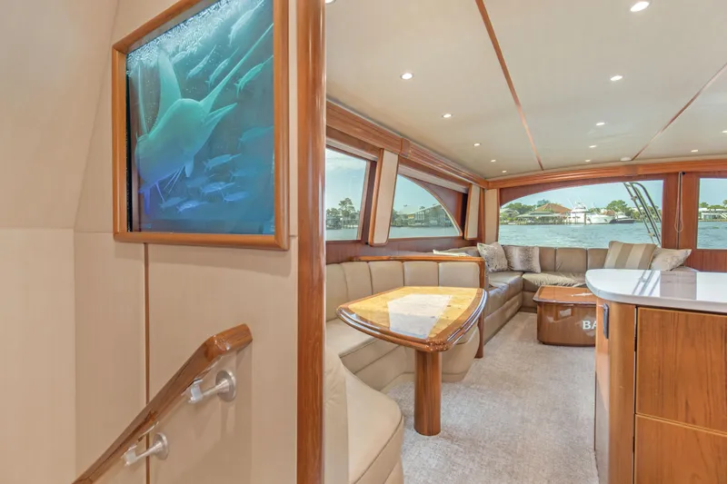 Slide: The Image of Luxurious interior of 2015 Viking 70 Convertible yacht with elegant seating and large windows. - 45
