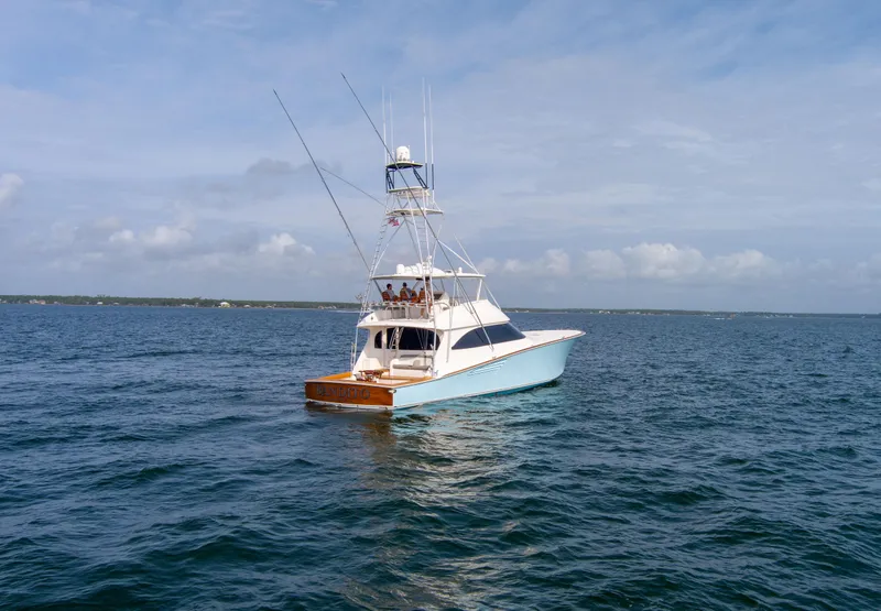 Slide: The Image of Viking 70 Convertible 2015 yacht on open water under blue sky. - 6