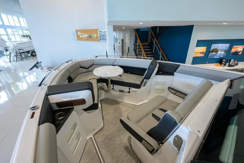 Slide: The Image of Interior of 2026 Monterey Elite 30 OB boat with modern seating and table. - 14