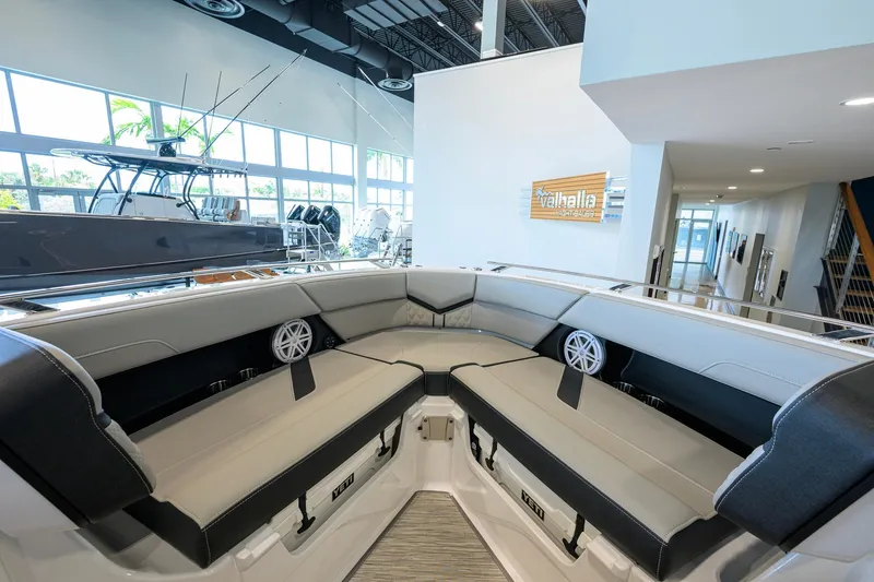 Slide: The Image of Interior of 2026 Monterey Elite 30 OB boat with luxurious seating and modern design. - 15