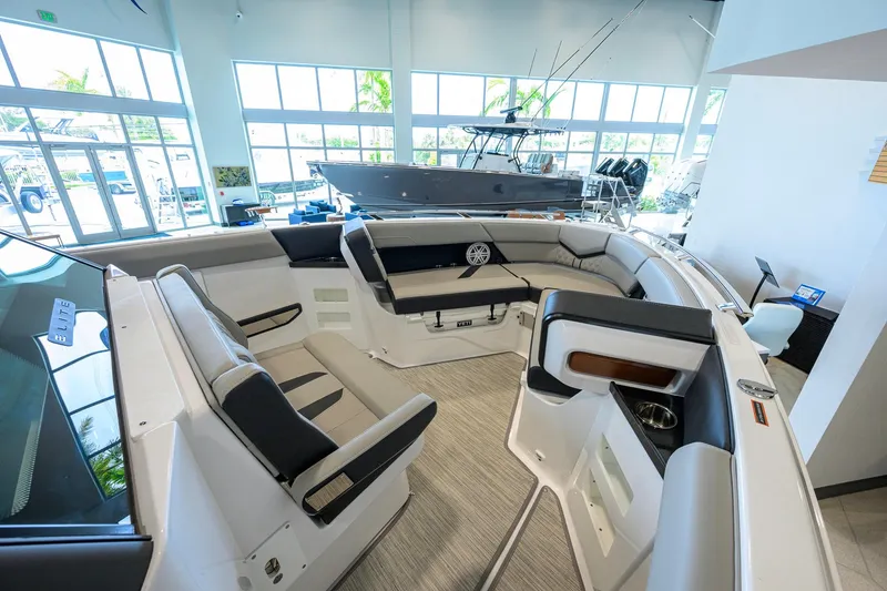 Slide: The Image of Interior of 2026 Monterey Elite 30 OB boat with luxurious seating and modern design. - 17