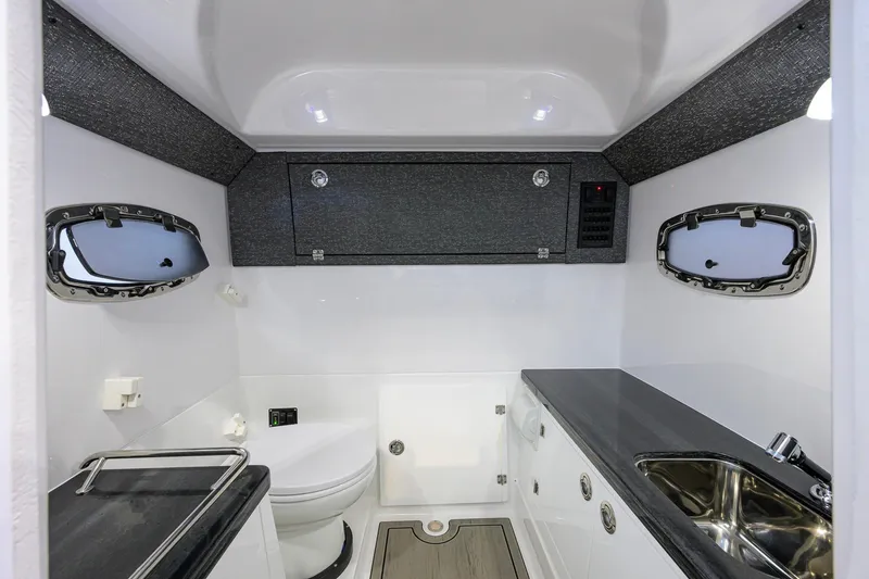 Slide: The Image of Luxurious bathroom interior of 2026 Monterey Elite 30 OB boat, featuring modern fixtures and sleek design. - 22