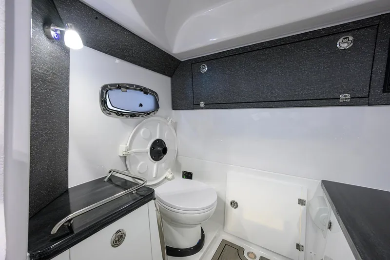 Slide: The Image of 2026 Monterey Elite 30 OB boat bathroom with modern fixtures and sleek design. - 23