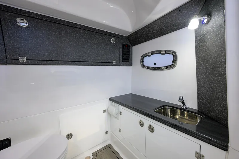 Slide: The Image of Luxurious bathroom interior of 2026 Monterey Elite 30 OB boat with sleek design. - 26