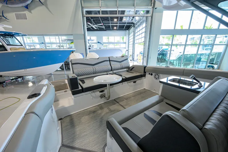 Slide: The Image of Luxurious interior of 2026 Monterey Elite 30 OB boat with plush seating and modern amenities. - 31