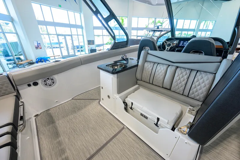 Slide: The Image of 2026 Monterey Elite 30 OB boat interior with luxurious seating and modern amenities. - 38