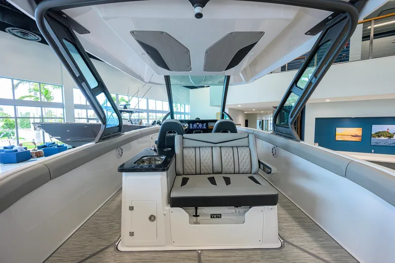 Slide: The Image of Interior of 2026 Monterey Elite 30 OB boat with seating and sink. - 39
