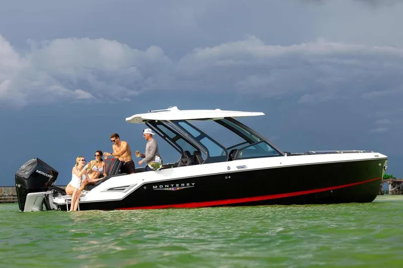 Slide: The Image of Manufacturer Provided Image: 2026 Monterey Elite 30 OB boat with people enjoying a day on the water. - 4