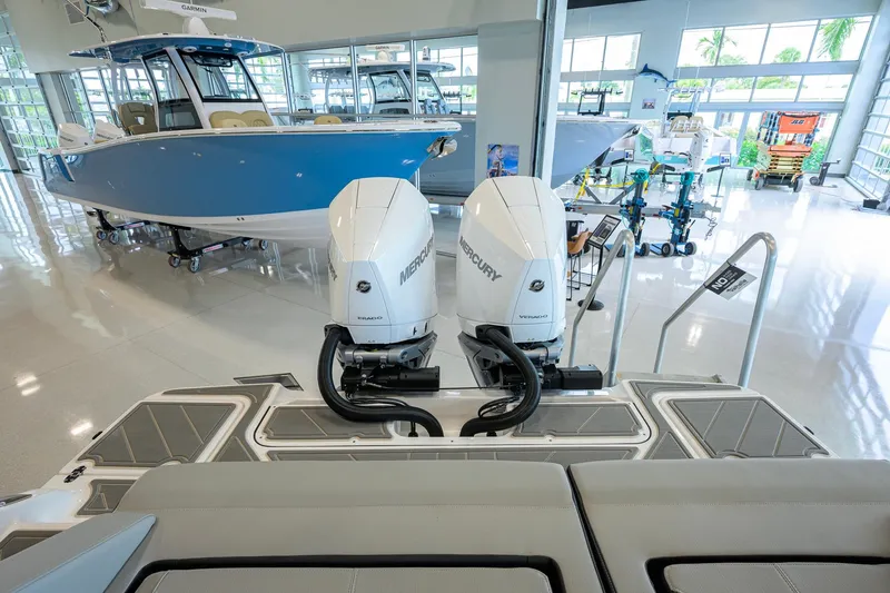 Slide: The Image of 2026 Monterey Elite 30 OB with dual Mercury engines in showroom. - 46