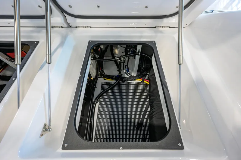 Slide: The Image of Open engine compartment of 2026 Monterey Elite 30 OB boat, showcasing interior components. - 52