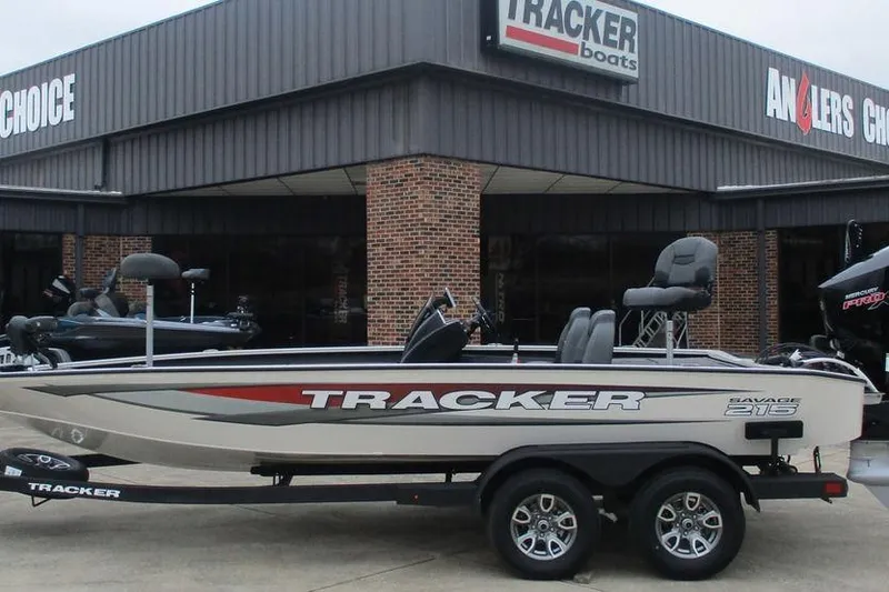 The Image of 2026 Tracker Savage 215 boat displayed outside dealership. - 1