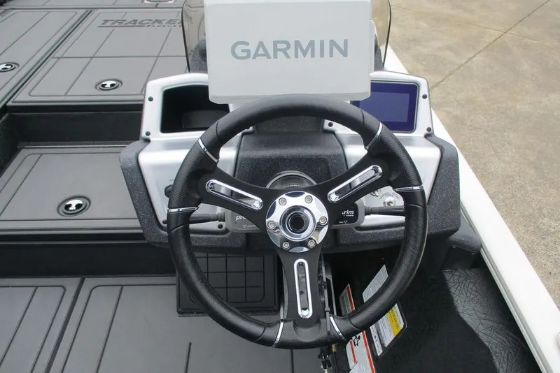 Slide: The Image of Steering wheel of 2026 Tracker Savage 215 boat with Garmin navigation system. - 11