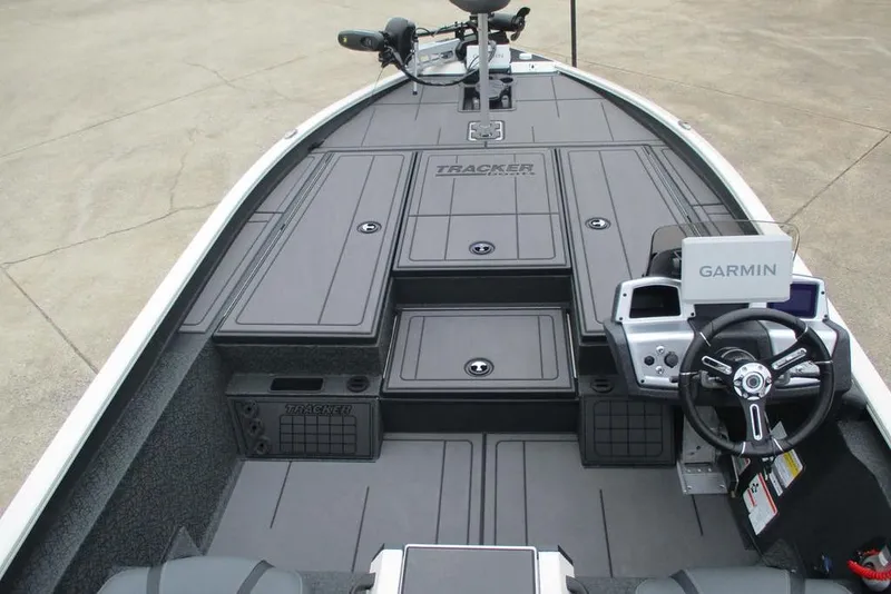 Slide: The Image of 2026 Tracker Savage 215 boat interior with Garmin navigation system and sleek design. - 12