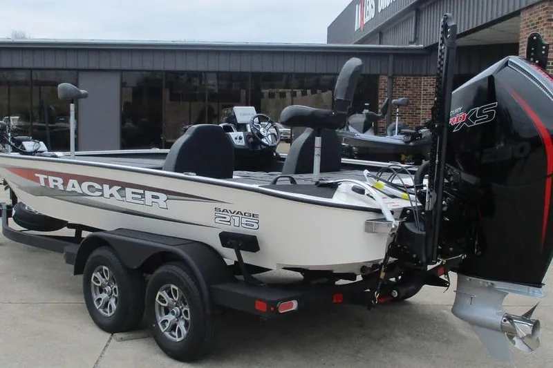 Slide: The Image of 2026 Tracker Savage 215 boat on trailer, featuring powerful outboard motor. - 5