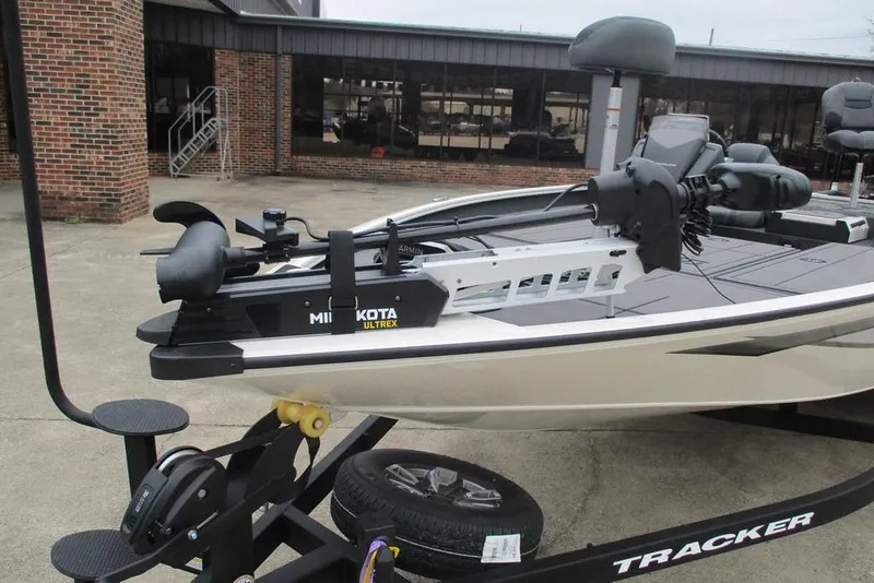 Slide: The Image of 2026 Tracker Savage 215 boat with Minn Kota Ultrex motor on trailer. - 9