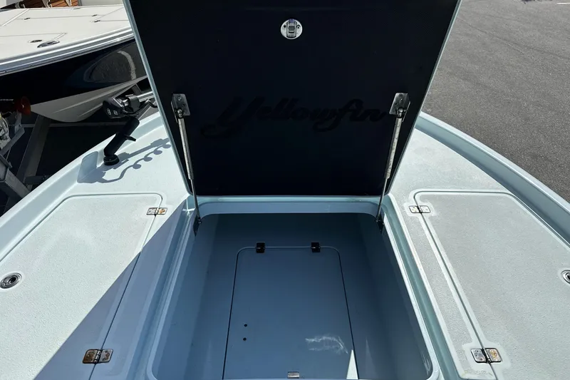 Slide: The Image of 2017 Yellowfin 24 Bay CE boat with open storage compartment on deck. - 10