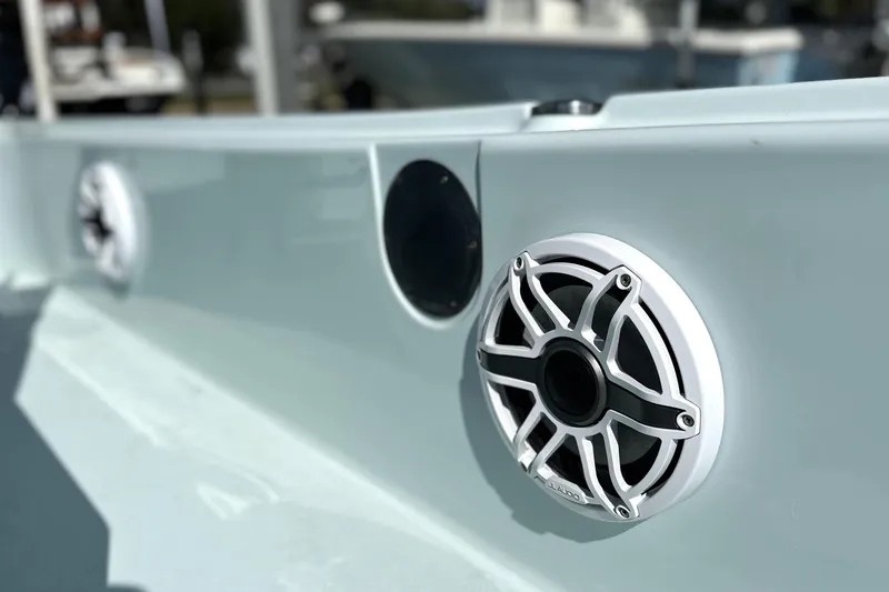 Slide: The Image of Close-up of 2017 Yellowfin 24 Bay CE boat speakers, showcasing sleek design and audio features. - 11