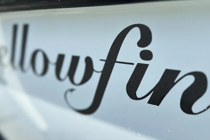 Slide: The Image of Yellowfin 24 Bay CE 2017 boat logo in elegant script font. - 12